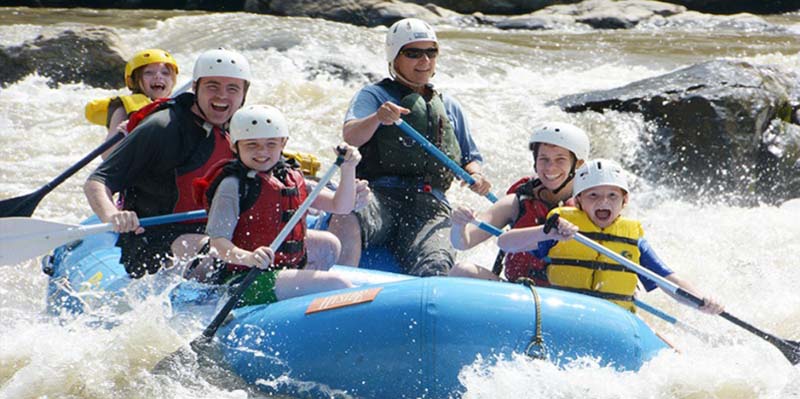 Family rafting on the river